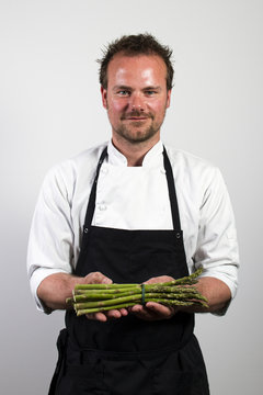 chef holding asparagus