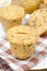 snack muffins with dried peppers and onions on a plate vertical