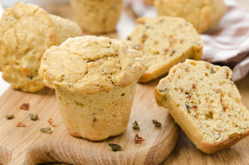 snack muffins with dried peppers and onions on a wooden board