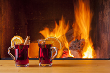 drinks at cozy fireplace
