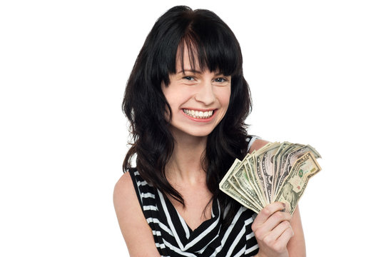 Smiling pretty girl with cash