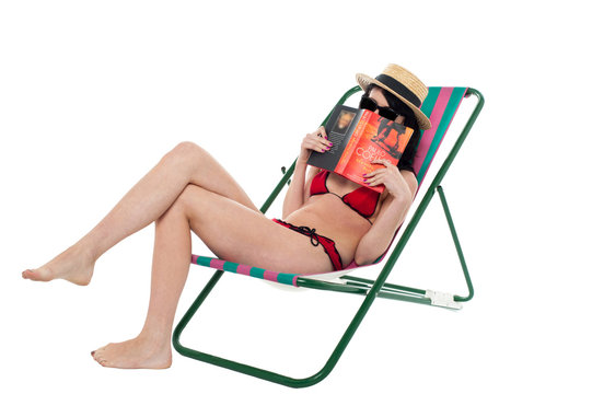 Bikini lady hiding her face with a book