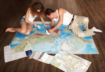 The man and the girl, for something searching, play paper ships