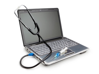 Modern laptop with a stethoscope and syringe for the treatment o