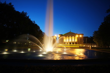 fountain before opera house in Poznan at night, Poland