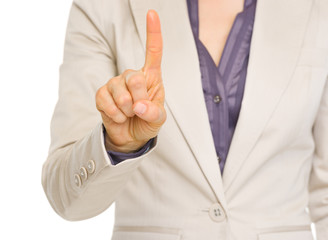 Closeup on business woman showing one with fingers