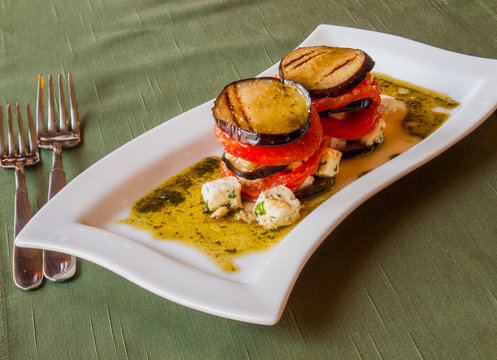 grilled eggplant with tomatoes​, in olive sauce with cheese