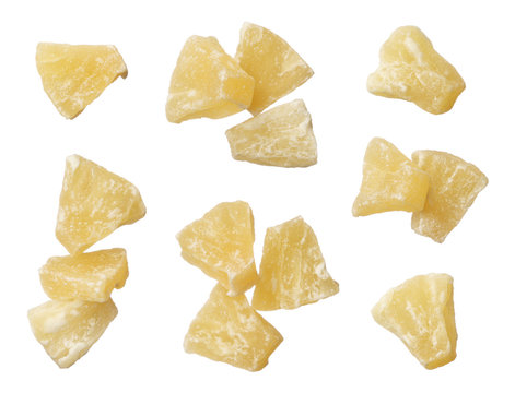 Dried pineapple pieces isolated on white background