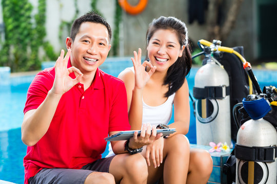 Dive Master And Student In Asian Diving School