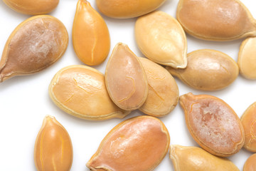 Obraz premium Pumpkin seeds on a white background. macro