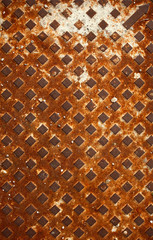 pattern of textured rusty metal with diagonal grid