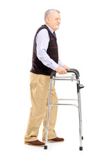 Full length portrait of a middle aged gentleman using a walker