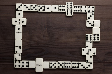 domino pieces on wooden table background