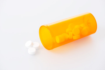 Pills spilling out of bottle