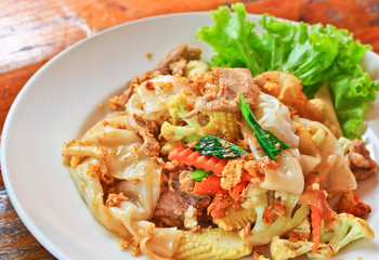 Stir fried noodles with egg, pork, vetgetables and sweet sauce