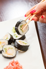 sushi with chopsticks