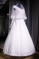 Fototapeta na wymiar Detail of a weddings dress on a mannequin