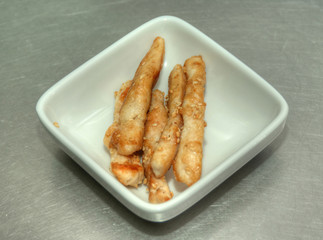 fish fillet in a white plate on the table
