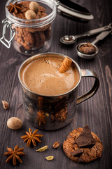 Coffee in the old mug, chocolate,   cookies and spices