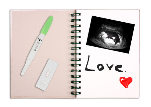 ultrasound film of thirteen week fetus or baby with 2 types pregnancy test and two red line on recycle diary book or notebook with love text and red heart shaped by draw on white background isolated