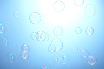Soap bubbles on blue background
