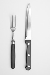 Fork and knife on grey background