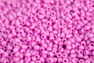 Lots beads pink color closeup background