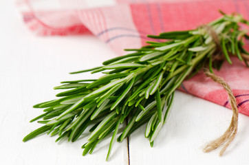 Small bunch of fresh rosemary on the table