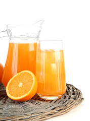 Glass and pitcher of orange juice isolated on white