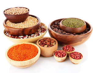Different kinds of beans in bowls isolated on white