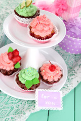 Delicious beautiful  cupcakes on festive table close-up