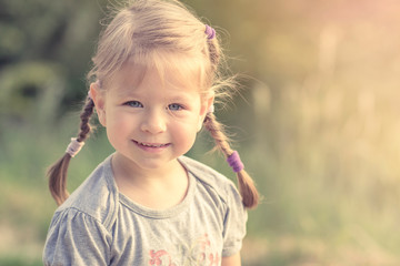 Portrait of a little cute smiling girl - 52572240