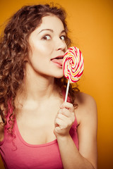 happy young woman with lollipop 