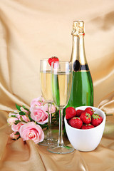 Romantic still life with champagne, strawberry and pink roses,