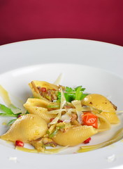 Vegetarian pasta with parsley, zucchini, tomatoes and parmesan