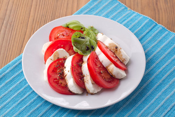 Italian salad caprese with tomatoes and mozzarella