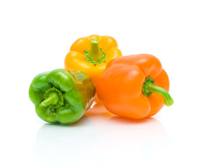 ripe sweet peppers on white background with reflection closeup
