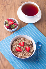 Breakfast with muesli and a cup of tea