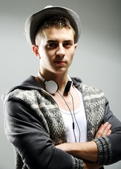 Man with hat - Young male in white t-shirt and jeans isolated on