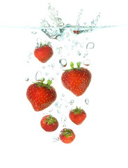 strawberrys falling in water