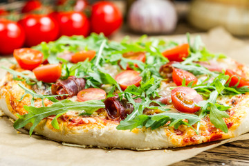 Closeup of pizza with parma ham