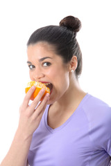 Model Released. Young Woman Eating an Orange