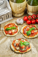 Fresh ingredients for a mini pizza with mushrooms