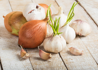 Garlic  and onion on wooden background