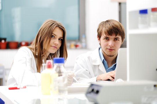 Young science workers research at medical lab