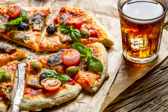 Freshly Baked Pizza Served With A Cold Drink