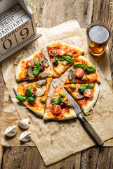 Freshly baked homemade pizza and serve with cold drink