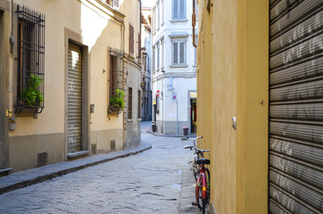 Medieval Alley with a bicycle against the wall, Florence, Italy