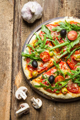 Freshly baked pizza with black olives
