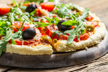 Closeup of fresh pizza with vegetables